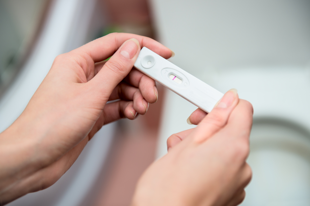 shock result for teenage boy following pregnancy test